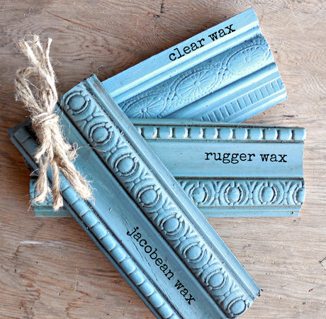 Moody Blue wood samples in clear, Rugger, and Jacobean wax by Old Fashioned Milk Paint on wood surface.