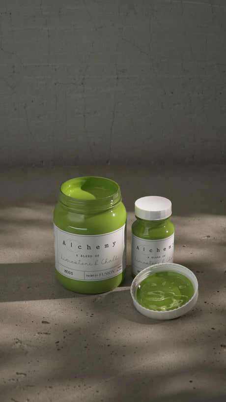 Two Fusion Mineral Paint Moss Alchemy jars, chalk-style, one opened to show paint on the lid.