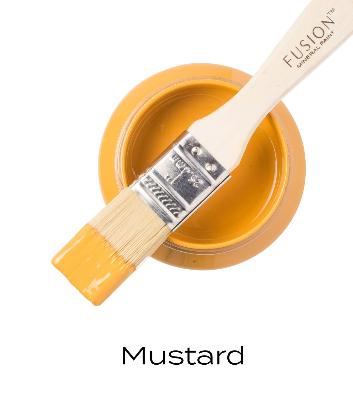 Brush with yellow Mustard Fusion Mineral Paint resting on open jar labeled Fusion Mineral Paint Mustard.