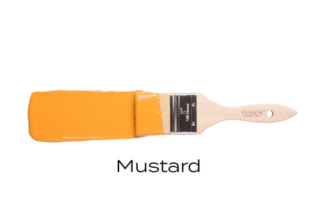 Paintbrush with yellow Mustard Fusion Mineral Paint bristles and “Mustard” text below.