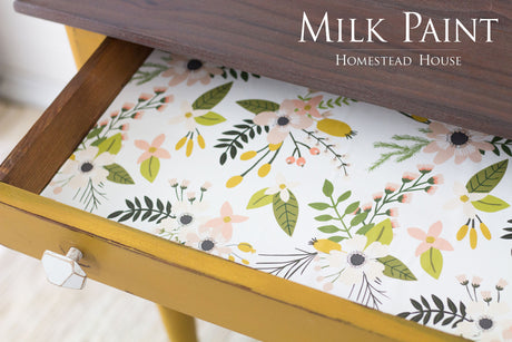 Open yellow drawer in Mustard Milk Paint by Homestead House, floral liner visible, branded text on wood top.