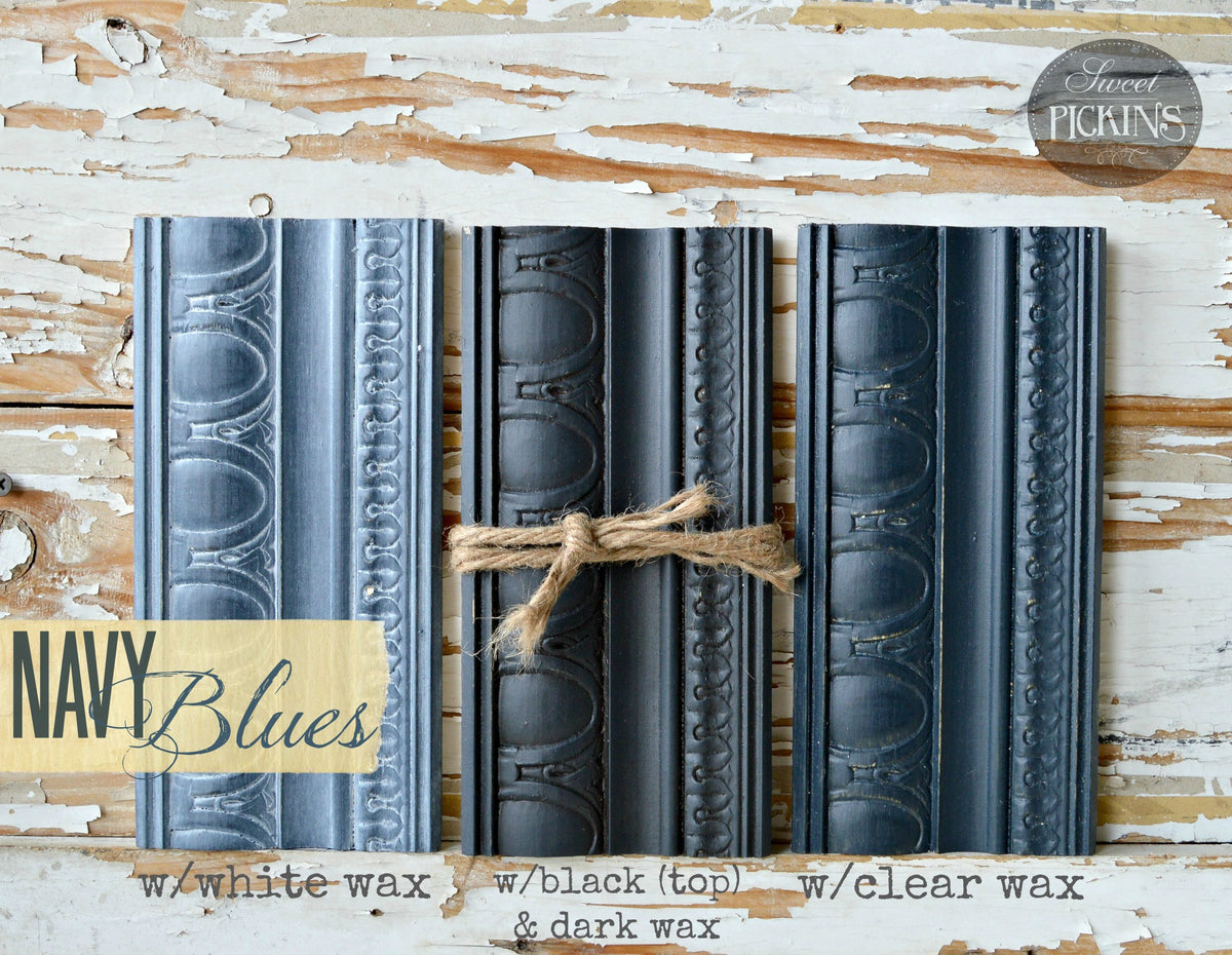 Three Navy Blues moldings by Old Fashioned Milk Paint with non-toxic wax finish on rustic white wood.