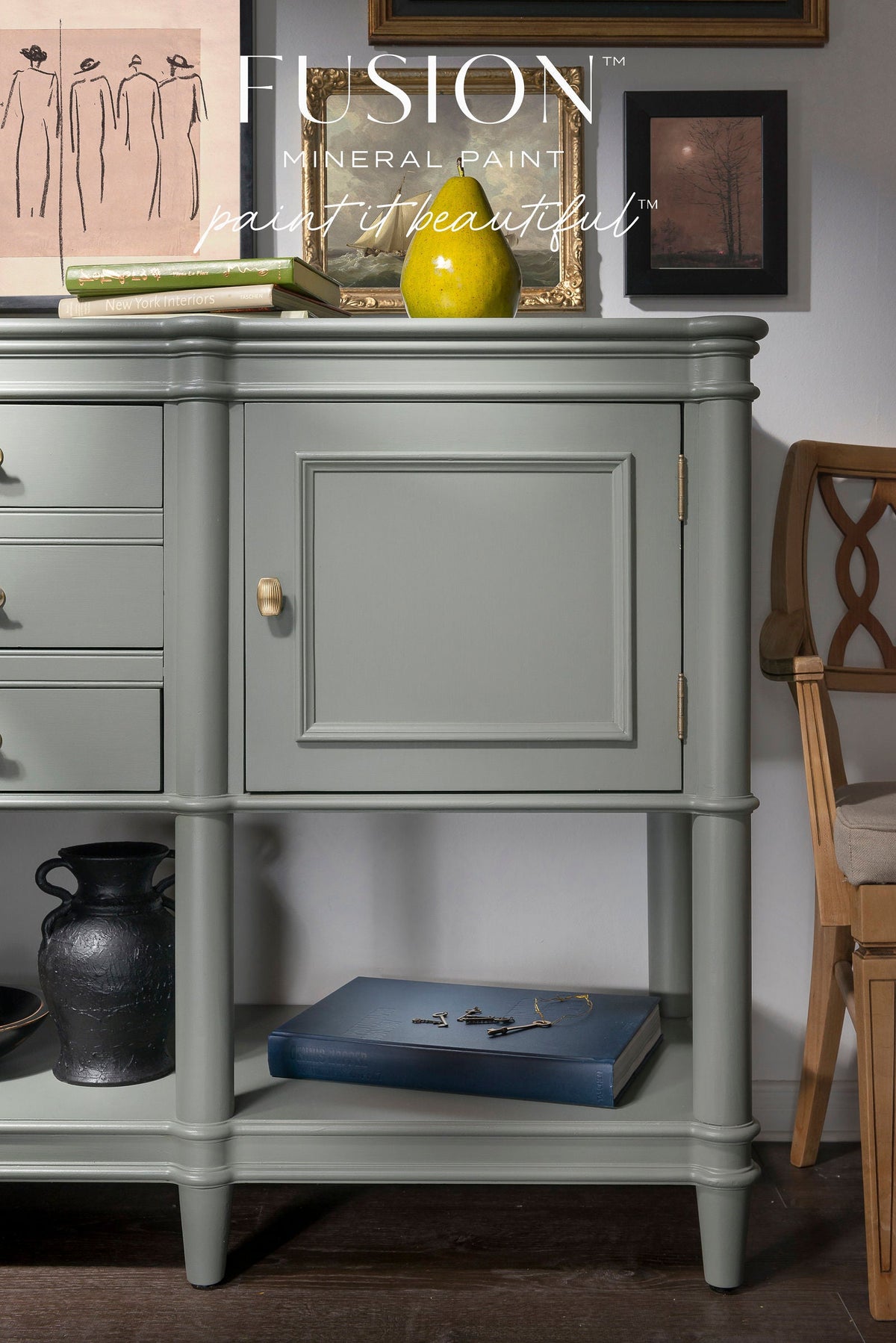 Sage Green Newell Fusion Mineral Paint sideboard with black vase, framed art, and branded cabinet text.