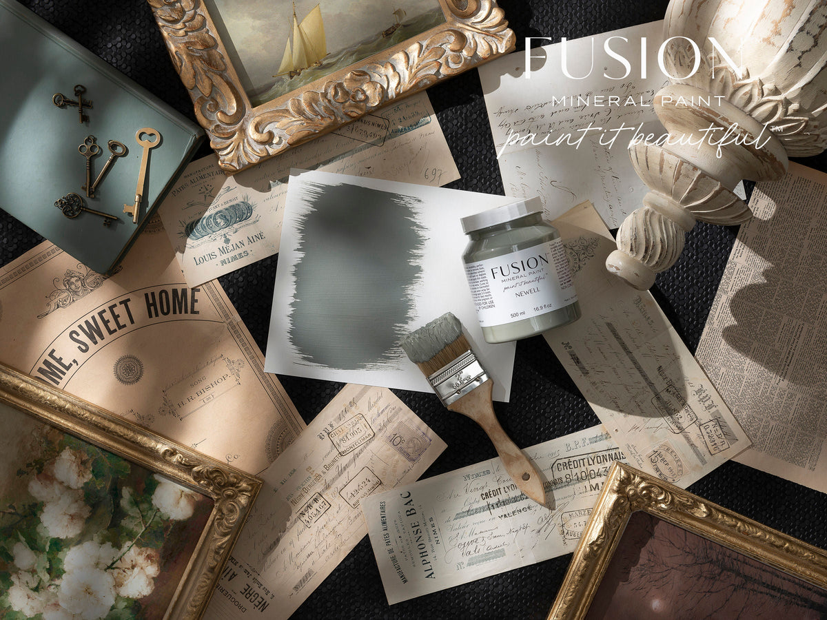 Newell Fusion Mineral Paint in sage green with brush, vintage papers, keys, and art accessories.