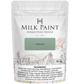 Homestead House Niagara Green Milk Paint 50g bag with floral design and visible cancer risk warning.