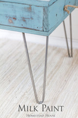 Blue-green wooden table with metal hairpin legs, finished in Homestead House Niagara Green Milk Paint.