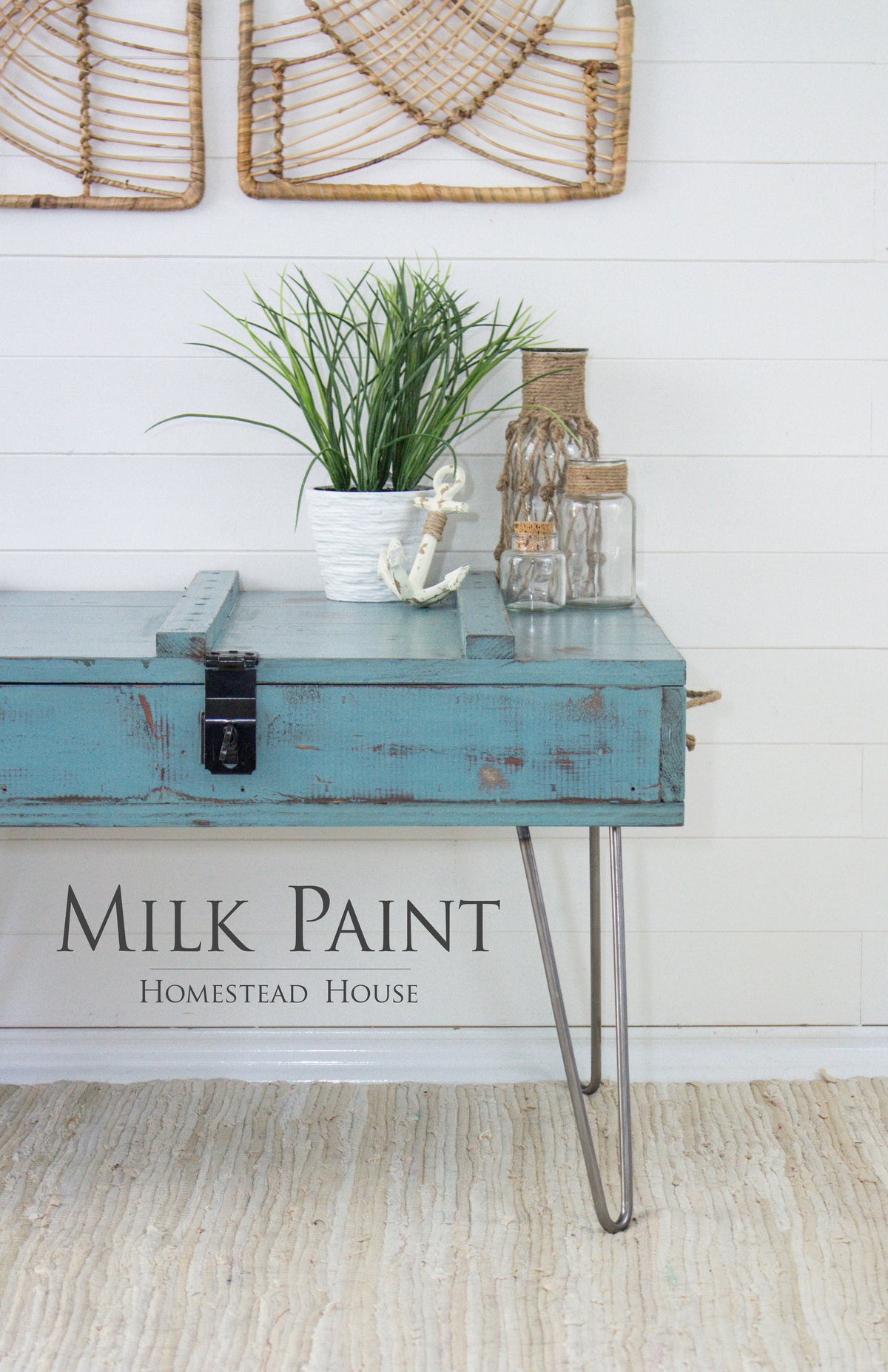 Table painted in Homestead House Niagara Green Milk Paint with decor and plants, set against a white shiplap wall.