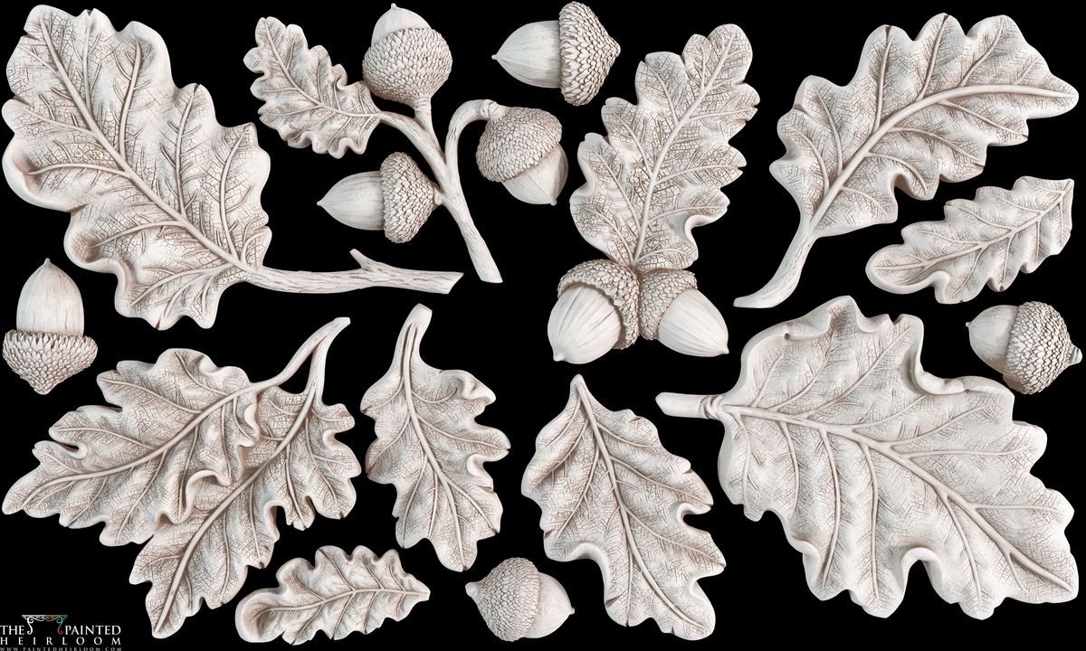 Sixteen I.O.D. Oak Leaves & Acorns Mould castings arranged on a bold black background.
