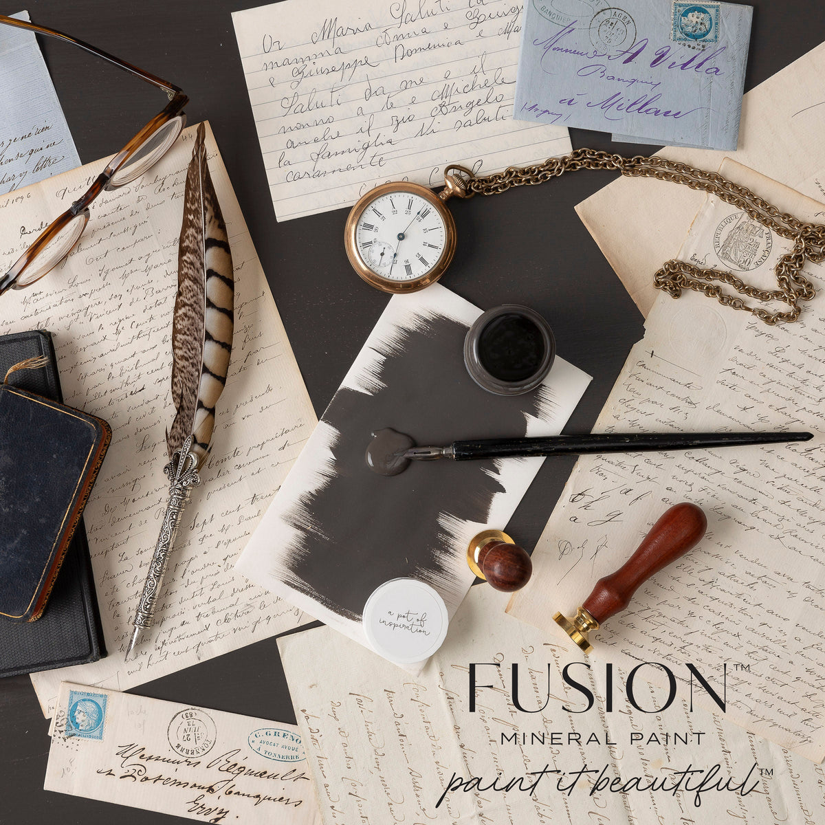 Oakham Fusion Mineral Paint swatch with writing tools, letters, and watch; matte finish by Fusion Mineral Paint.