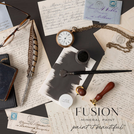 Oakham Fusion Mineral Paint swatch with writing tools, letters, and watch; matte finish by Fusion Mineral Paint.