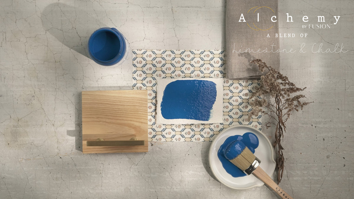 Alchemy by Fusion Digital Downloads with brush, wood block, dried flowers, and painted tile on cracked surface.