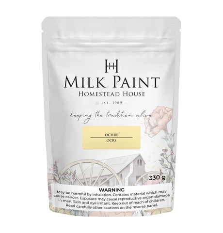330g Homestead House Ochre Milk Paint bag with rustic watermill image and warning label at the bottom.