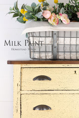 Yellow dresser in Ochre Milk Paint by Homestead House; “Homestead House” text displayed.