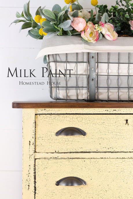 Yellow dresser in Ochre Milk Paint by Homestead House; “Homestead House” text displayed.