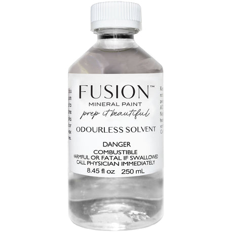 Fusion Mineral Paint Odorless Solvent, 250ml clear bottle with white cap, labeled as wax remover and turpentine substitute.