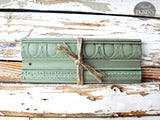 Green wood trim tied with twine, painted in Oh Olive! by Sweet Pickins Milk Paint, Old Fashioned Milk Paint Co.