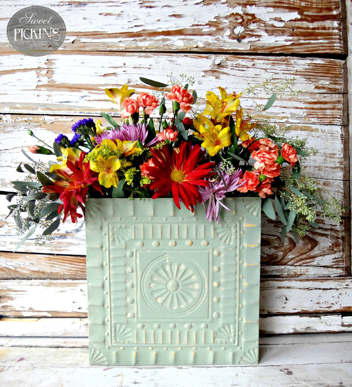 Oh Olive! pale green wall pocket by Old Fashioned Milk Paint holding wildflowers.