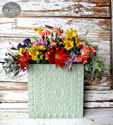 Oh Olive! pale green wall pocket by Old Fashioned Milk Paint holding wildflowers.