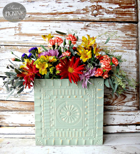 Oh Olive! pale green wall pocket by Old Fashioned Milk Paint holding wildflowers.