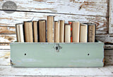 Wooden drawer painted Oh Olive! by Old Fashioned Milk Paint, repurposed as a book holder.
