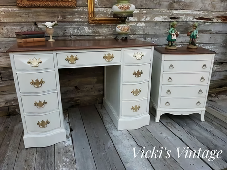Two white vintage desks with brass hardware, refinished with Miss Lillian’s Old Cupboard No-Wax Chock Paint.