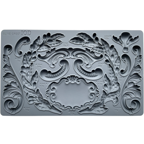 Olive Crest Mould by I.O.D. with ornate leaves and scrolls, dimensions shown in the corner.