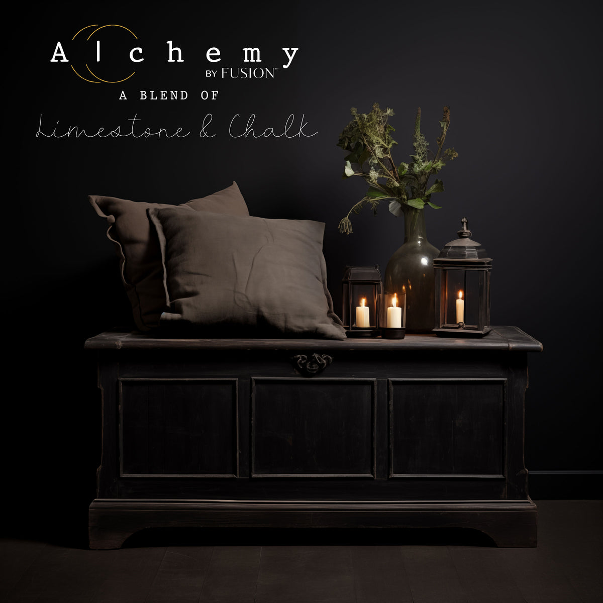 Chest painted in Onyx Alchemy by Fusion Mineral Paint, shown with pillows, candles, and a vase.