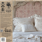 Pale pink headboard, white bedding, four pillows; I.O.D. Palais des Fleurs Stamp historic pattern detail.