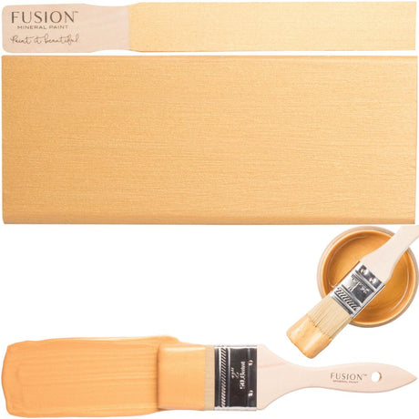 Paintbrush, gold-painted surface, and open jar of Fusion Mineral Paint Pale Gold Metallic.