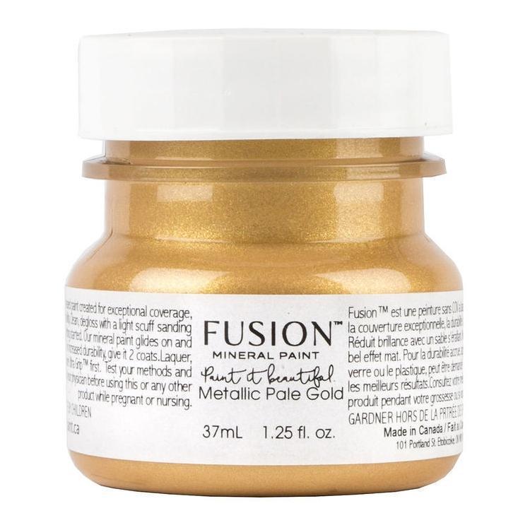 37 mL jar of Fusion Mineral Paint, Pale Gold Metallic, with gold paint visible inside the container.
