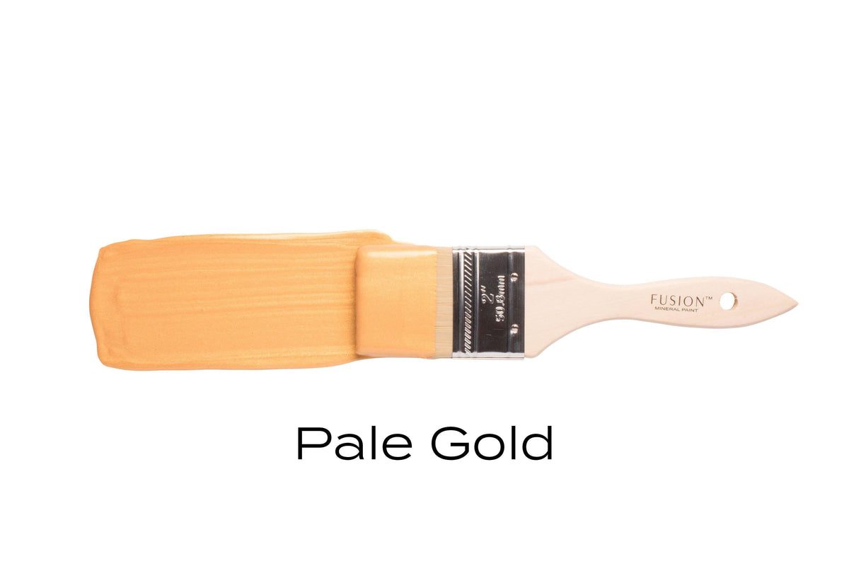 Fusion Mineral Paint brush with Pale Gold Metallic above the color name “Pale Gold” on a white background.