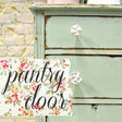 Old Fashioned Milk Paint mint cabinet with white knobs, floral paper interior, and Pantry Door script overlay.