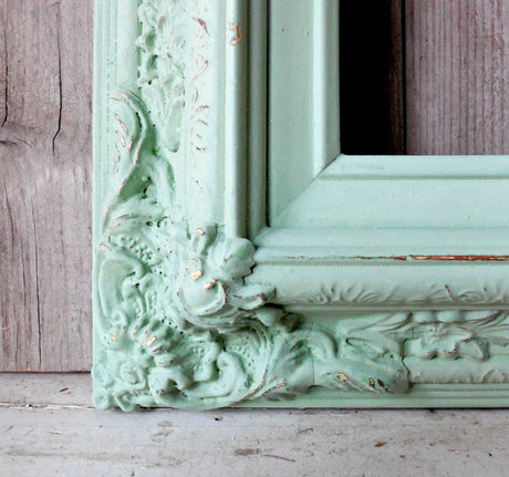 Ornate frame detail in Pantry Door–Sweet Pickins Milk Paint by Old Fashioned Milk Paint, showing wood grain.