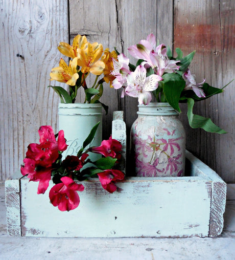Three jars with flowers in a crate painted Pantry Door by Old Fashioned Milk Paint.