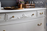 Parchment Fusion Mineral Paint on dresser with gold hardware, shown with the slogan paint it beautiful™.