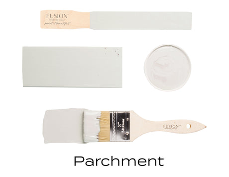 Fusion Parchment Fusion Mineral Paint samples displayed on brushes, wood, and a round dish.