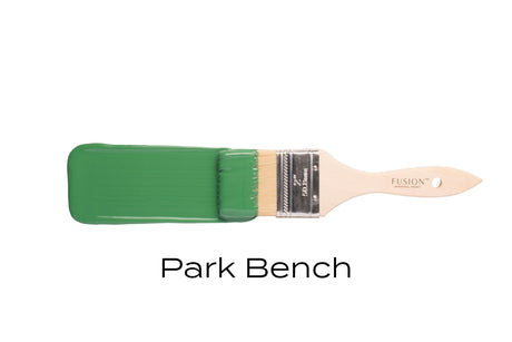 Fusion Mineral Paint Park Bench with label, next to a paintbrush, on a white background.