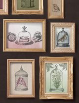 The Pastiche Stamp by IOD with ornate gold frames and vintage-style sketches of birds, books, and a clock.