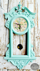 Vintage wall clock with Patina frame by Old Fashioned Milk Paint, floral face, pendulum, and distressed wood.