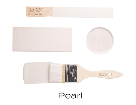 Four paint samples and a brush featuring Fusion Mineral Paint Pearl Metallic, a light shade with subtle mica pigments.