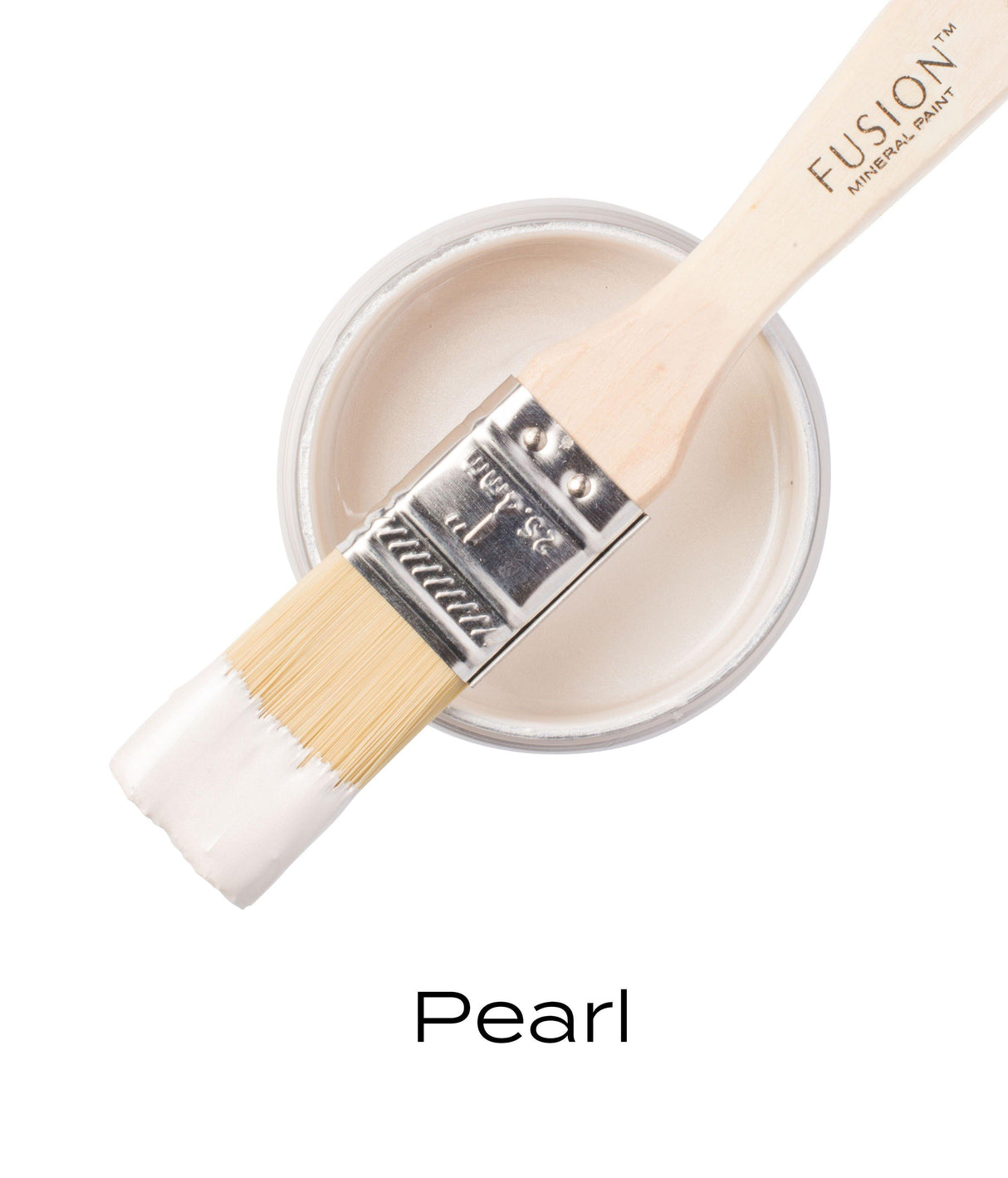 Paintbrush with white paint resting on a jar labeled “Pearl Metallic Fusion Mineral Paint” by Fusion Mineral Paint.