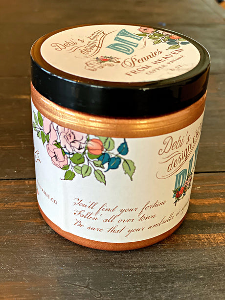 DIY Paint Co. Pennies from Heaven Copper Liquid Patina jar with label visible on a wooden surface.