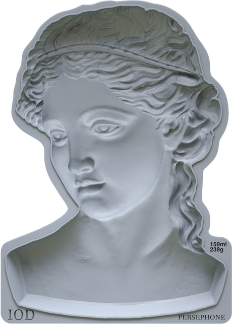 White plaster relief of a woman’s head made with the Persephone Mould by IOD (Iron Orchid Designs).
