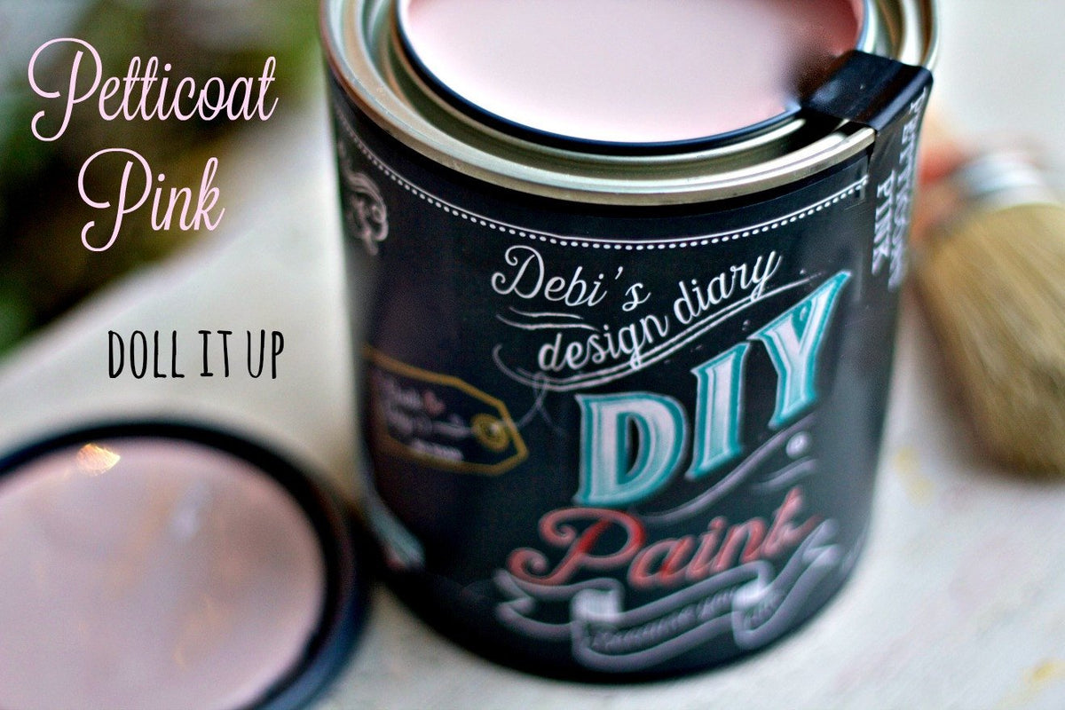Open can of DIY Paint Co. Petticoat Pink DIY Paint with lid and brush; product label visible.