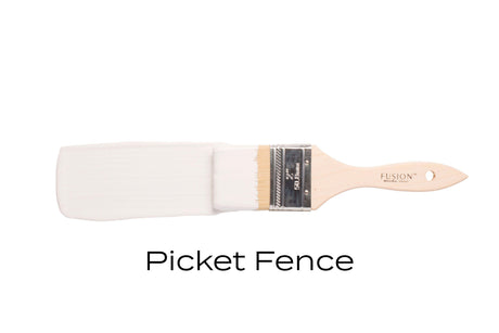 Fusion Mineral Paintbrush dipped in Picket Fence Fusion Mineral Paint on a white background.