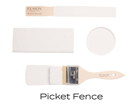 Paintbrush with Fusion Mineral Paint in Picket Fence, paint swatch, open can, and Picket Fence label displayed.