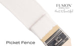 Brush with white Picket Fence Fusion Mineral Paint on bristles, shown with branding on a white background.