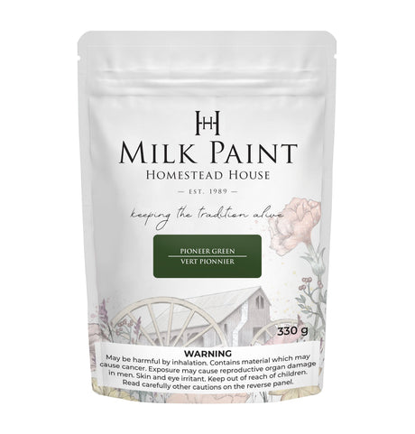 Homestead House Pioneer Green Milk Paint 330g bag with flower and wagon wheel graphics, safety warnings on packaging.