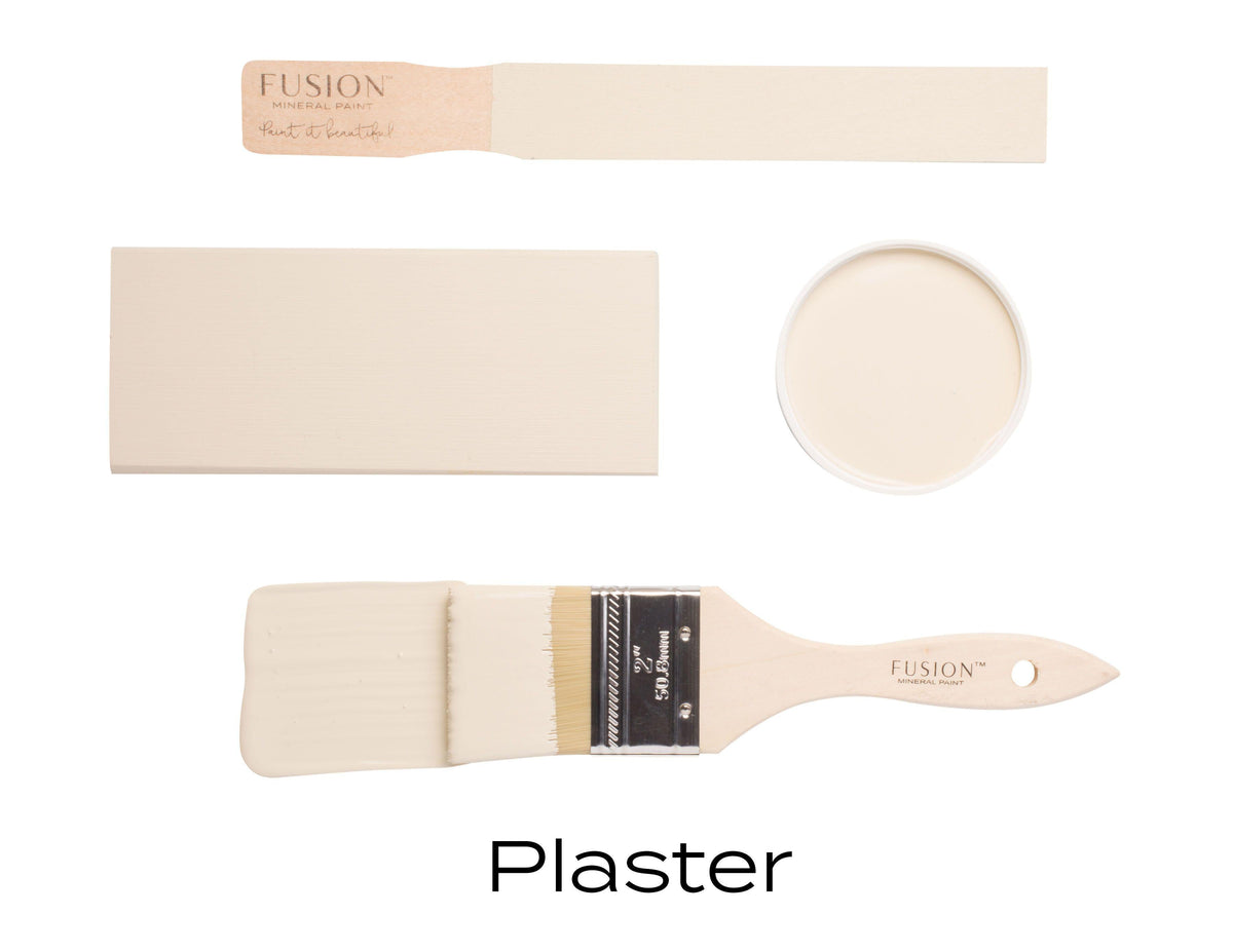 Two beige sample boards, a can of Plaster Fusion Mineral Paint, and a brush labeled Plaster matte finish.