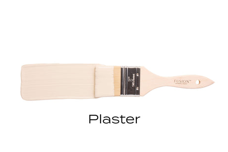 Fusion Mineral Paint Plaster shade shown on a wooden brush, highlighting its matte finish.